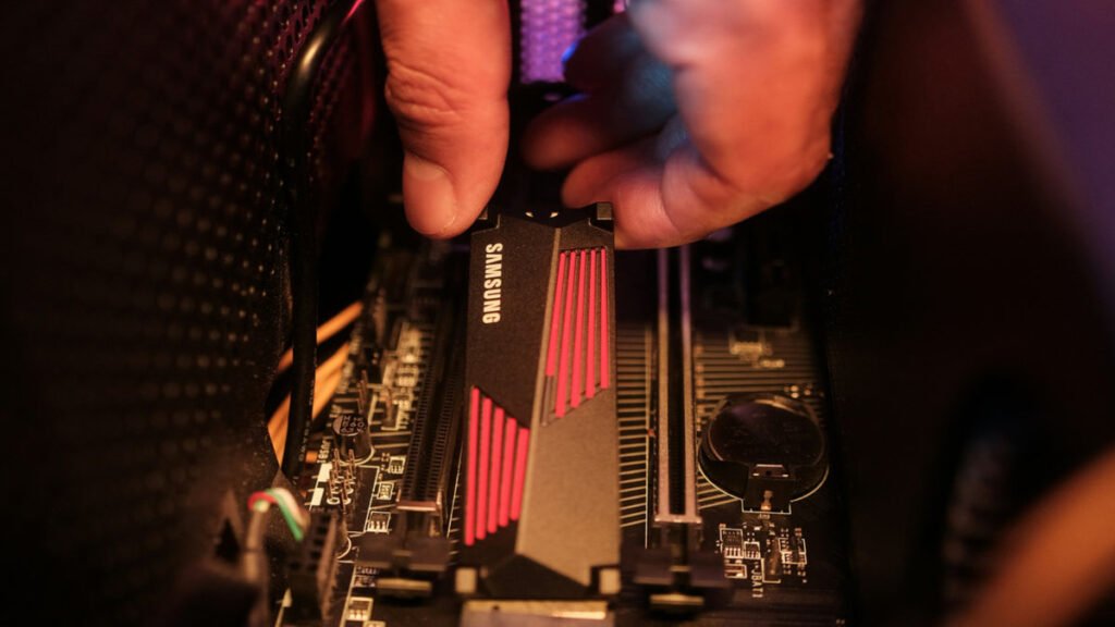 Hand placing an integrated electronic circuit into place.